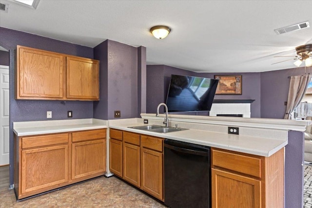 kitchen featuring visible vents, dishwasher, open floor plan, a peninsula, and a sink