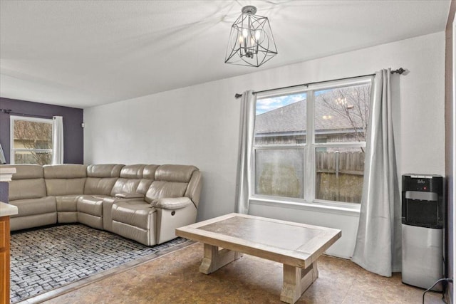 living room with a notable chandelier and a wealth of natural light