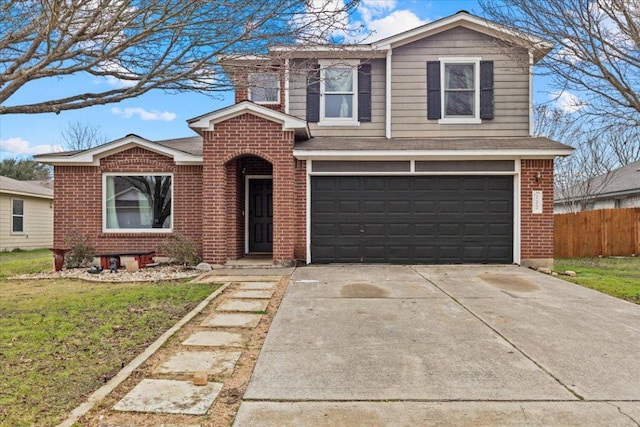 traditional-style home featuring brick siding, an attached garage, a front yard, fence, and driveway