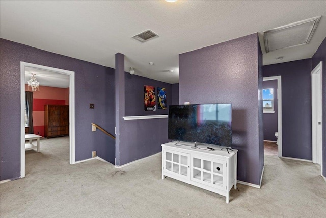 living area with baseboards, visible vents, and carpet flooring