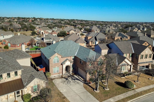 birds eye view of property with a residential view