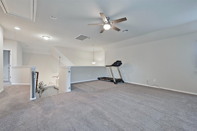 interior space featuring attic access, baseboards, visible vents, and carpet flooring