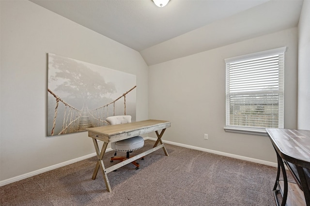 office featuring lofted ceiling, carpet floors, and baseboards