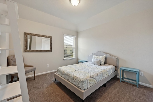 carpeted bedroom featuring lofted ceiling and baseboards