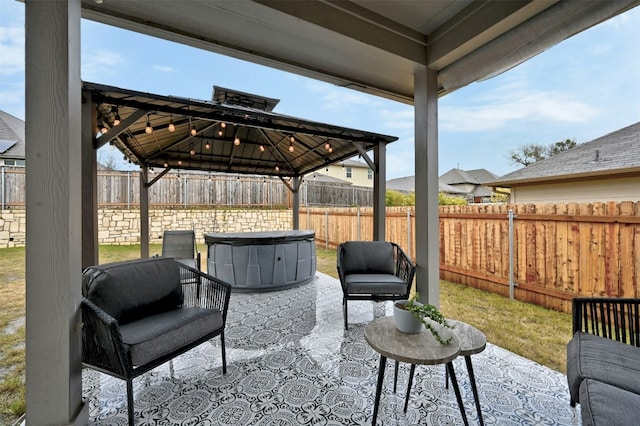 view of patio / terrace featuring a fenced backyard and a gazebo