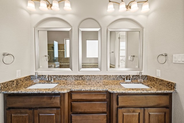 full bathroom featuring double vanity and a sink