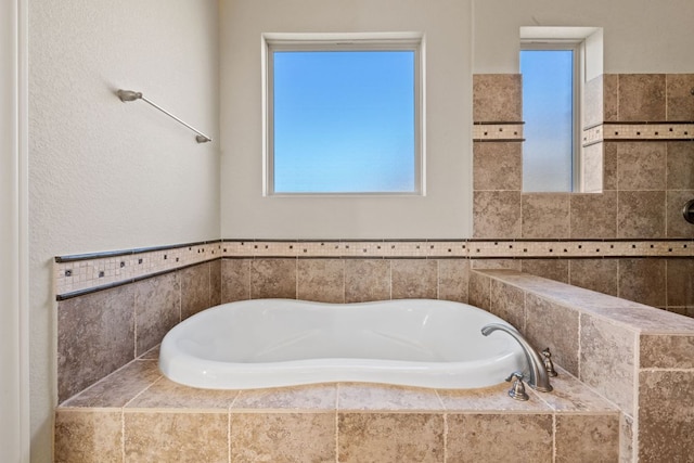 bathroom with a garden tub