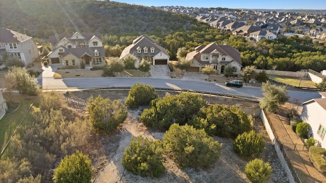 birds eye view of property with a residential view and a view of trees