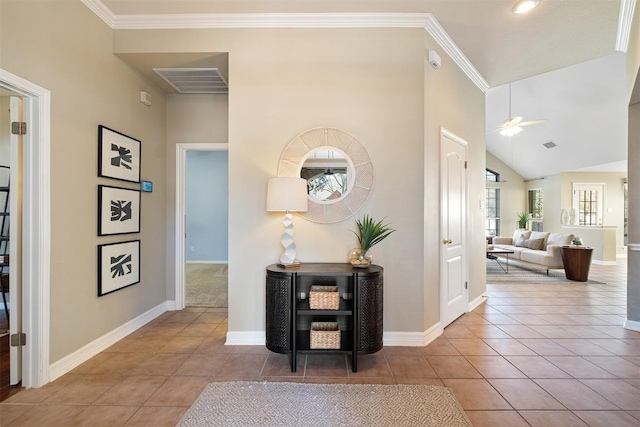 hallway with tile patterned floors, visible vents, baseboards, and ornamental molding