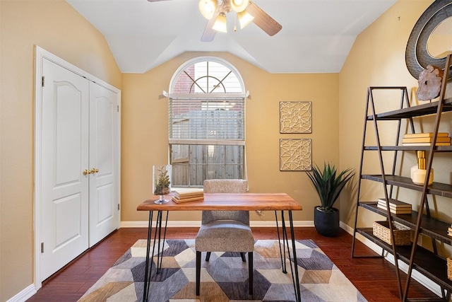 office area featuring vaulted ceiling, ceiling fan, baseboards, and wood finished floors