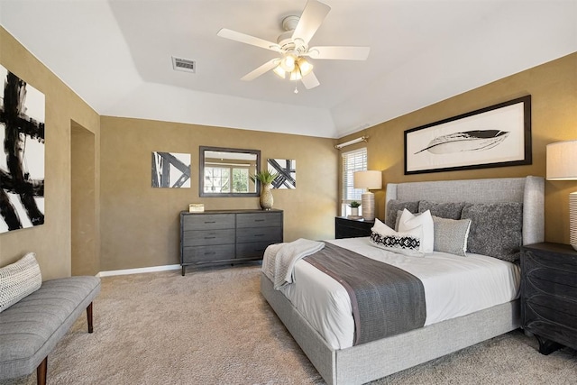 carpeted bedroom featuring visible vents, baseboards, and a ceiling fan