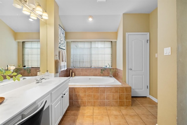 full bathroom featuring tile patterned flooring, visible vents, vanity, and a garden tub