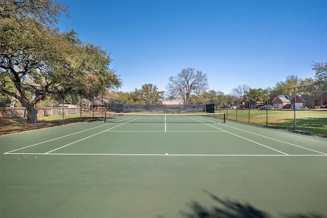 view of tennis court with fence