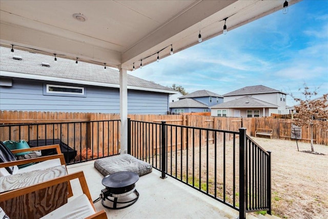 exterior space with a residential view and a fenced backyard