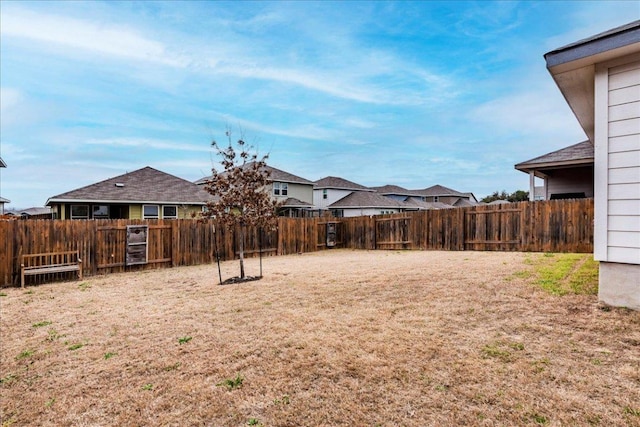 view of yard with a fenced backyard