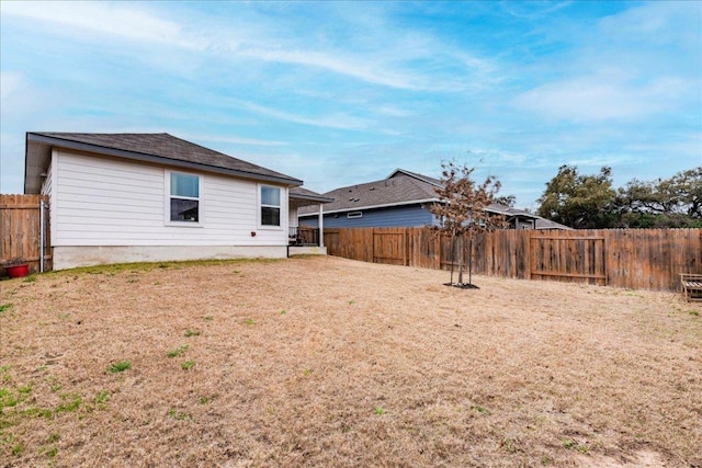 view of yard featuring a fenced backyard