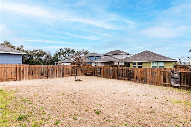 view of yard with a fenced backyard