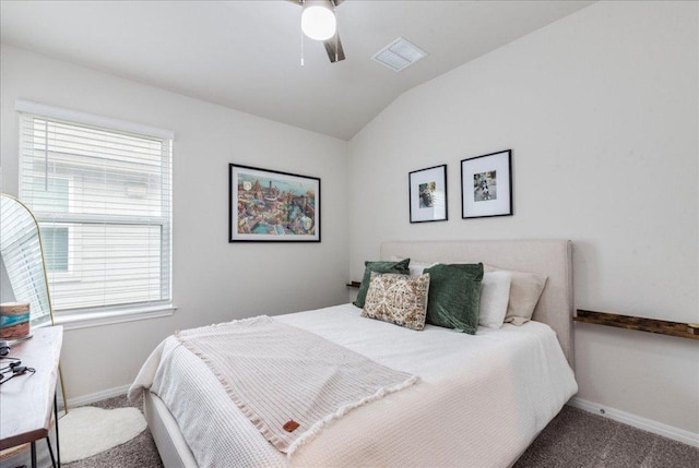 bedroom featuring carpet, visible vents, multiple windows, and lofted ceiling