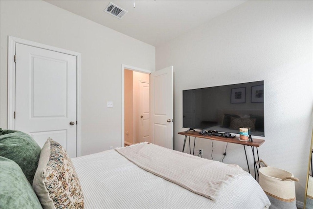 bedroom featuring visible vents