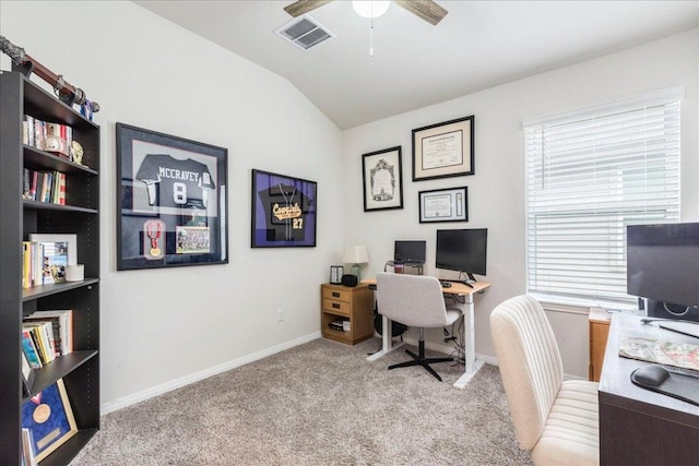 office featuring visible vents, carpet flooring, vaulted ceiling, ceiling fan, and baseboards