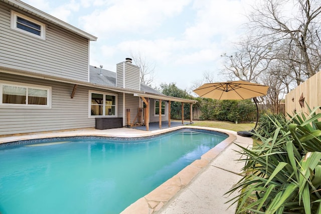 view of pool featuring a fenced in pool, fence private yard, and a patio