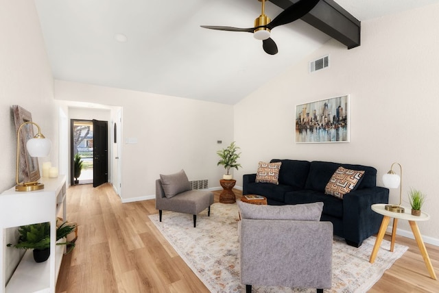 living room with visible vents, light wood-style flooring, lofted ceiling with beams, a ceiling fan, and baseboards