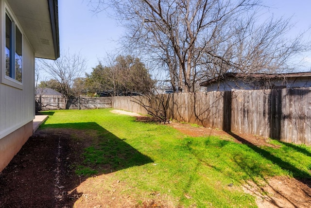 view of yard with a fenced backyard