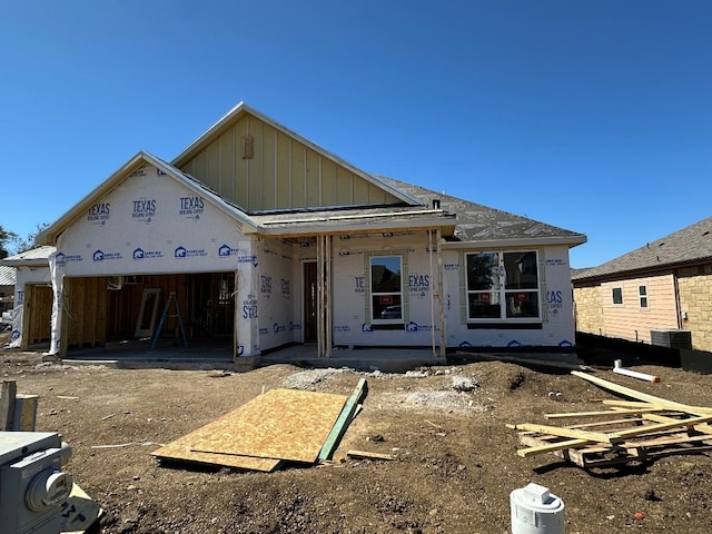 property in mid-construction with a garage and board and batten siding