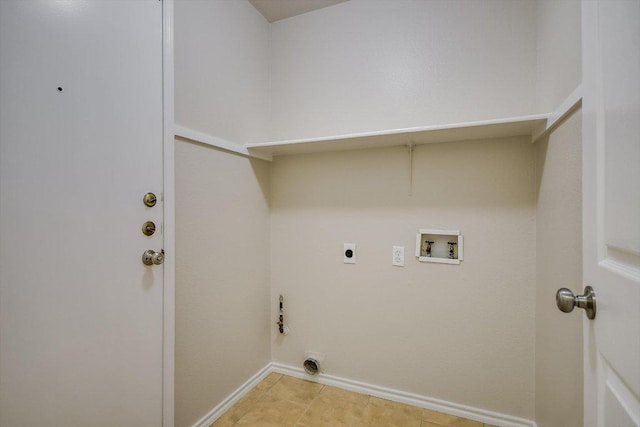 clothes washing area with laundry area, hookup for a washing machine, electric dryer hookup, and baseboards