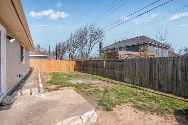 view of yard with a patio area and a fenced backyard