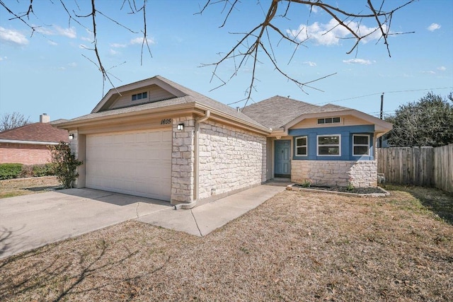 view of front of property featuring a garage, stone siding, fence, and driveway