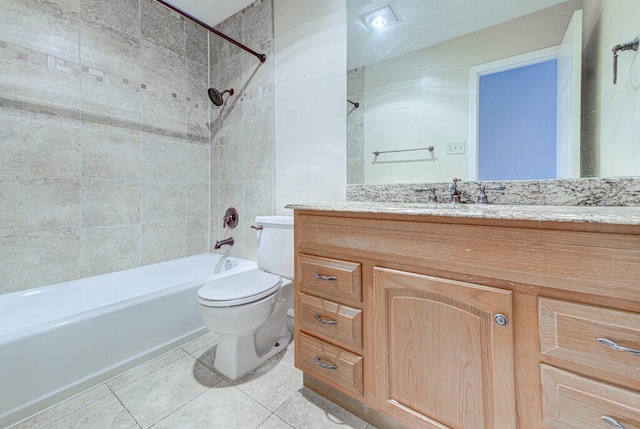 bathroom featuring toilet, tile patterned flooring,  shower combination, and vanity