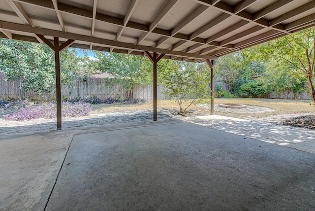 view of patio with a fenced backyard and a fire pit