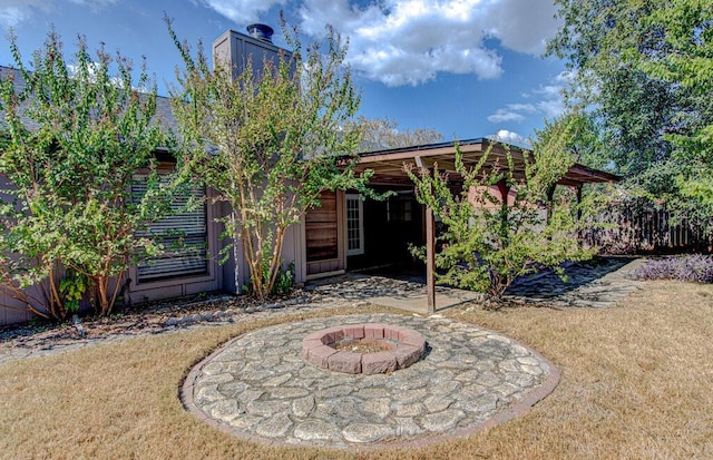 view of yard with a patio area and a fire pit