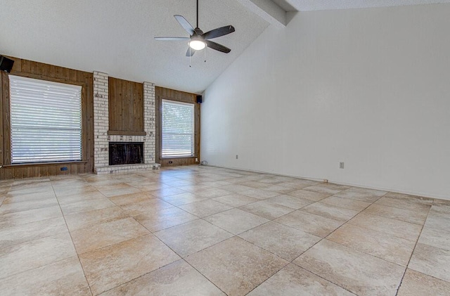 unfurnished living room featuring high vaulted ceiling, a textured ceiling, a ceiling fan, and beam ceiling