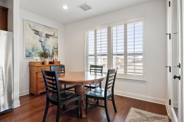 dining space featuring dark wood-style floors, baseboards, visible vents, and recessed lighting