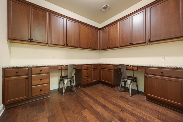 205 Agave Bloom Cv, Austin, TX 78738 - unfurnished office featuring built in study area, dark wood-type flooring, and baseboards