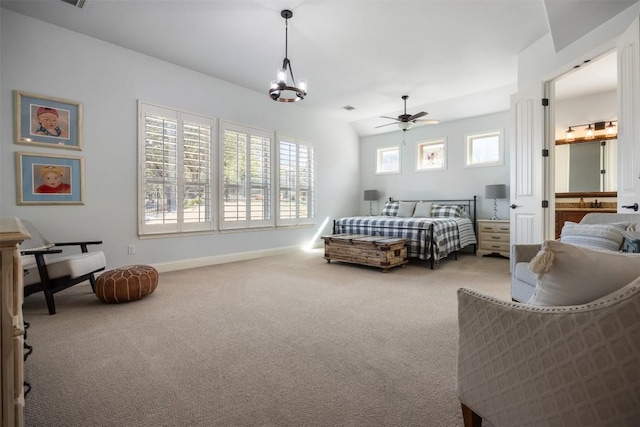 carpeted bedroom with visible vents, baseboards, and an inviting chandelier