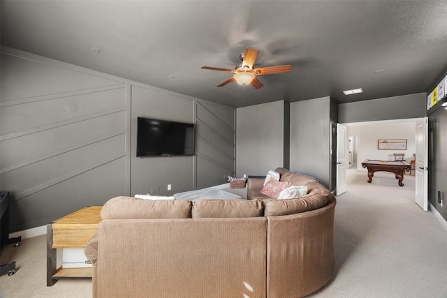 living room with light carpet, ceiling fan, and billiards