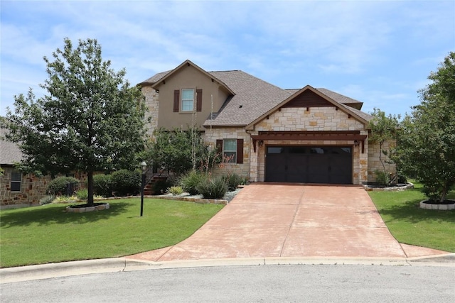 205 Agave Bloom Cv, Austin, TX 78738 - view of front of home featuring stone siding, a front yard, a garage, and stucco siding