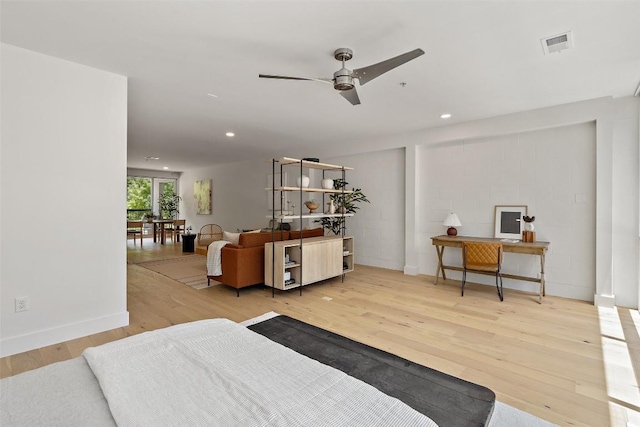 bedroom with baseboards, visible vents, wood finished floors, and recessed lighting