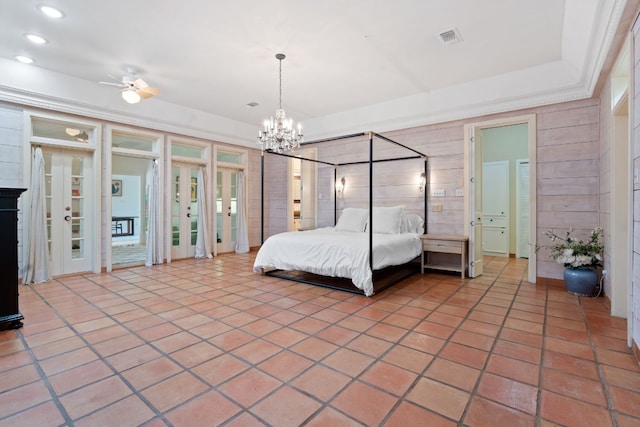 unfurnished bedroom featuring a notable chandelier, recessed lighting, visible vents, wood walls, and tile patterned floors