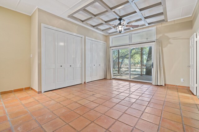 6615 La Concha Pass, Austin, TX 78749 - unfurnished bedroom featuring access to outside, multiple closets, beamed ceiling, baseboards, and coffered ceiling