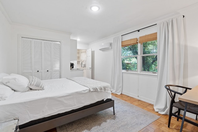 bedroom with ornamental molding, an AC wall unit, and a closet