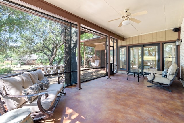 sunroom featuring ceiling fan