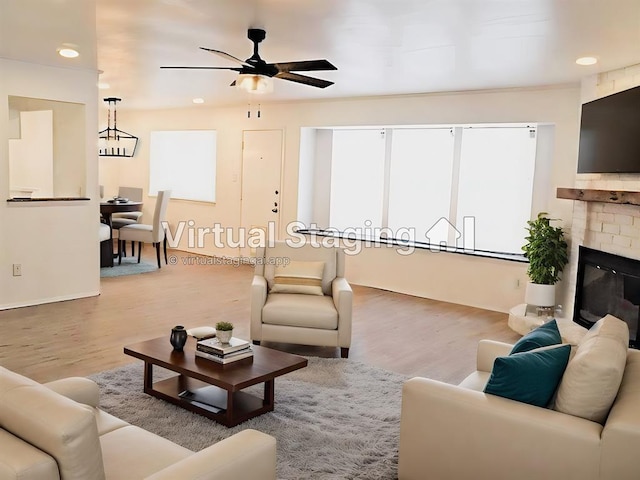 6705 Lancret Hill Dr, Austin, TX 78745 - living area with wood finished floors, a ceiling fan, baseboards, a brick fireplace, and recessed lighting