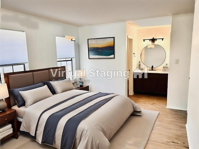 bedroom with ensuite bath and light wood finished floors