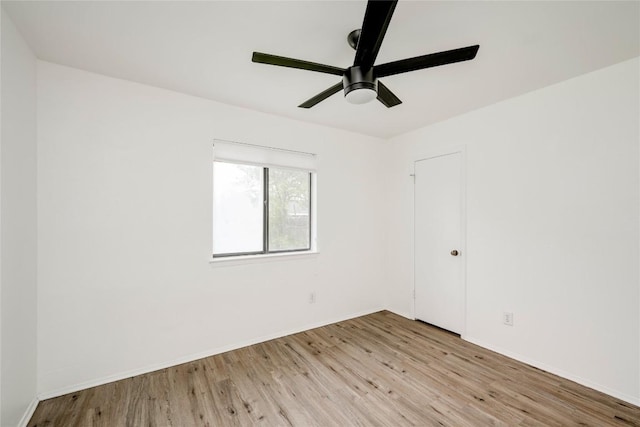 6705 Lancret Hill Dr, Austin, TX 78745 - unfurnished room with wood finished floors, ceiling fan, and baseboards