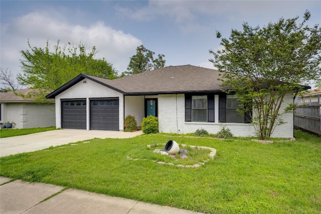single story home with a front lawn, driveway, an attached garage, and brick siding