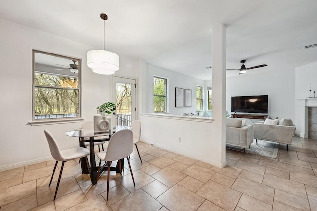 dining space featuring visible vents, ceiling fan, and baseboards